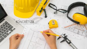 hand-construction-plans-with-yellow-helmet-drawing-tool-koncretiza